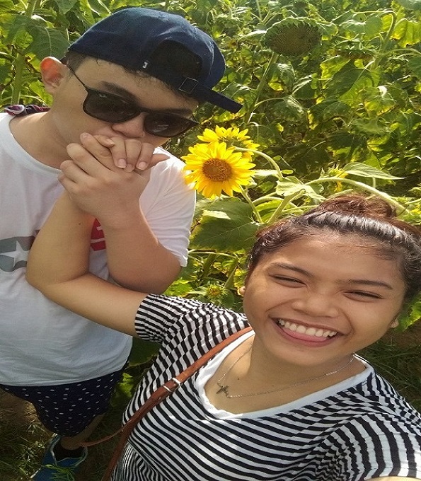 With wildflower, Kawa-kawa hill Ligao City